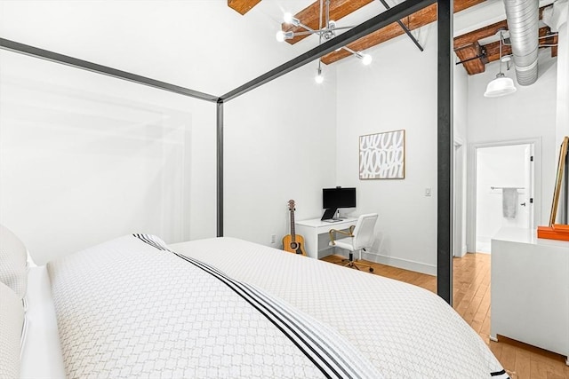 33 Sleeper St Unit 106, Boston, MA 02210 - bedroom featuring light wood-type flooring, a high ceiling, and a ceiling fan