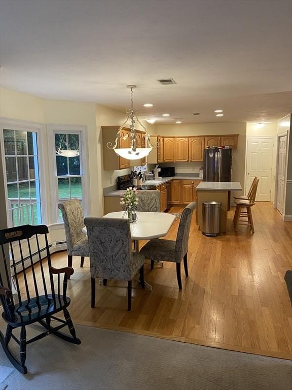 52 Cranberry Rd, Hanson, MA 02341 - dining room with baseboard heating, light wood finished floors, and recessed lighting