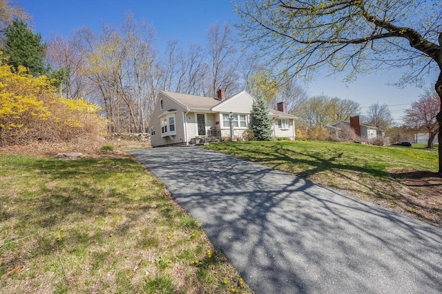 5 Northgate Rd, Chelmsford, MA 01824 - ranch-style house featuring asphalt driveway, a chimney, and a front lawn