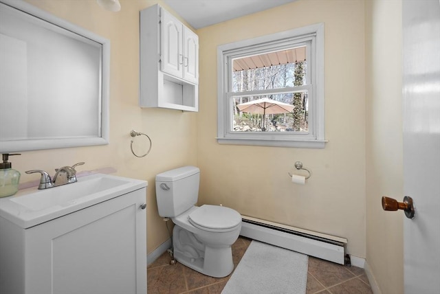 5 Northgate Rd, Chelmsford, MA 01824 - half bathroom with baseboard heating, vanity, and tile patterned floors