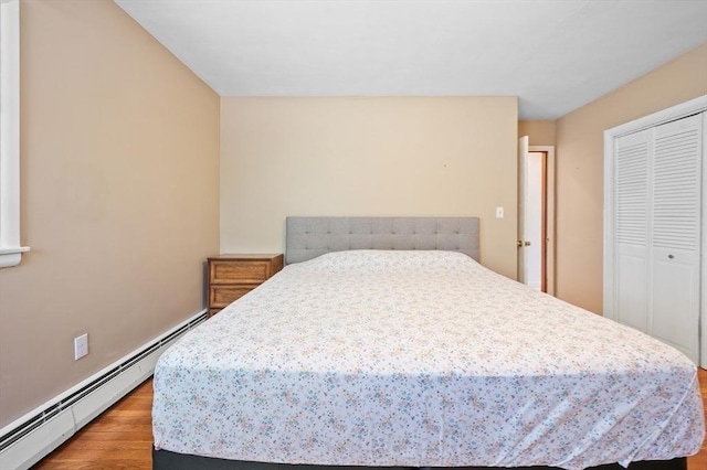 5 Northgate Rd, Chelmsford, MA 01824 - bedroom with a baseboard radiator, wood finished floors, and a closet