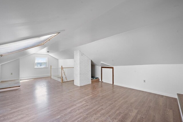 5 Northgate Rd, Chelmsford, MA 01824 - additional living space featuring vaulted ceiling and wood finished floors