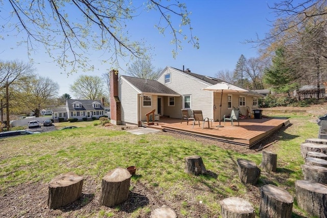 5 Northgate Rd, Chelmsford, MA 01824 - rear view of house featuring a deck, a lawn, and a chimney