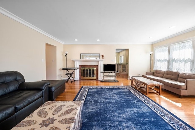 5 Northgate Rd, Chelmsford, MA 01824 - living area featuring wood finished floors, ornamental molding, a brick fireplace, and recessed lighting
