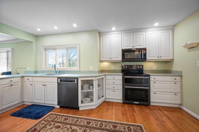 5 Northgate Rd, Chelmsford, MA 01824 - kitchen featuring dishwasher, double oven range, light wood-type flooring, white cabinetry, and recessed lighting