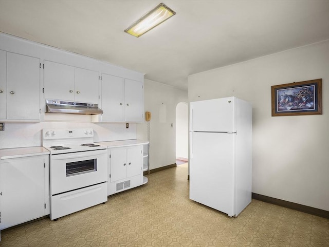kitchen with white appliances, under cabinet range hood, light countertops, and baseboards