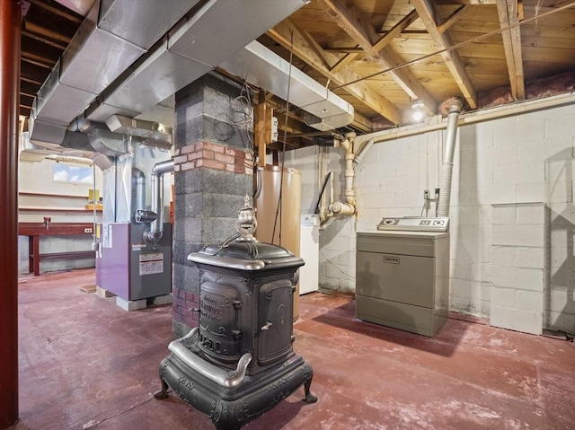 unfinished below grade area featuring separate washer and dryer and heating unit