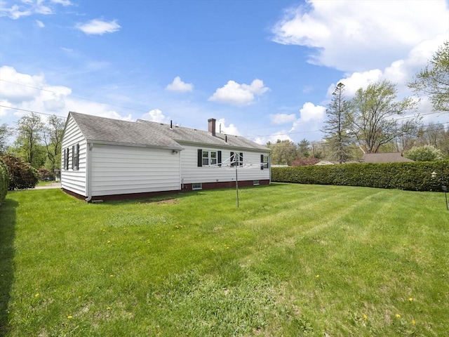 back of house featuring a yard