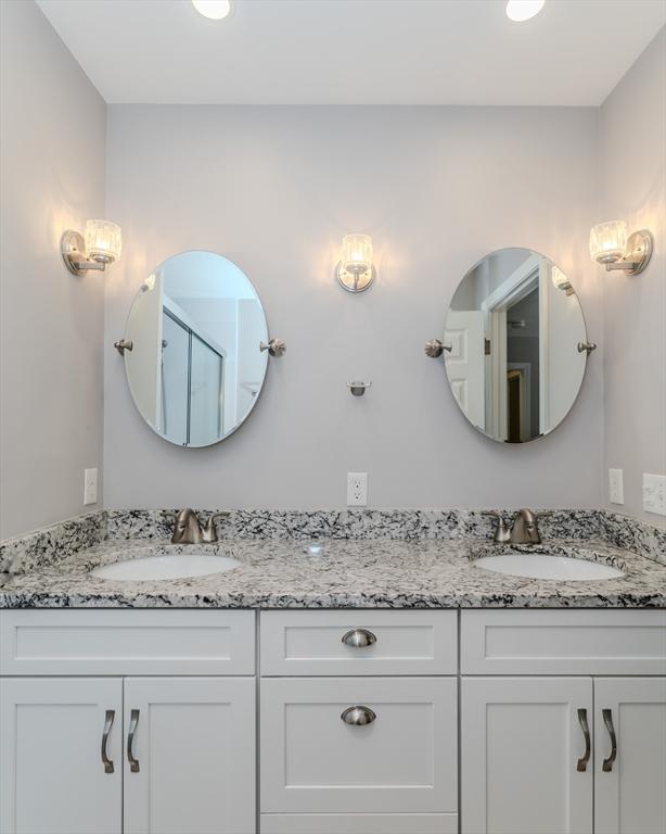 bathroom featuring double vanity and a sink