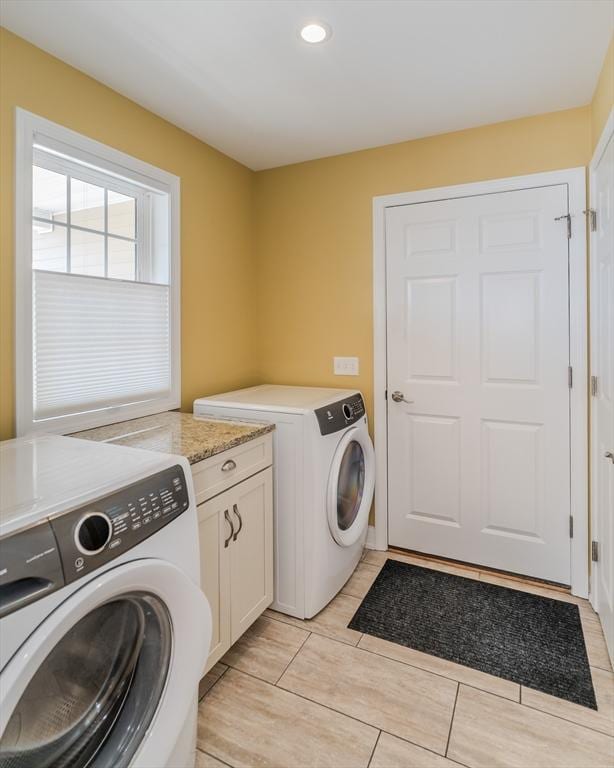 clothes washing area with recessed lighting, cabinet space, and washer and clothes dryer