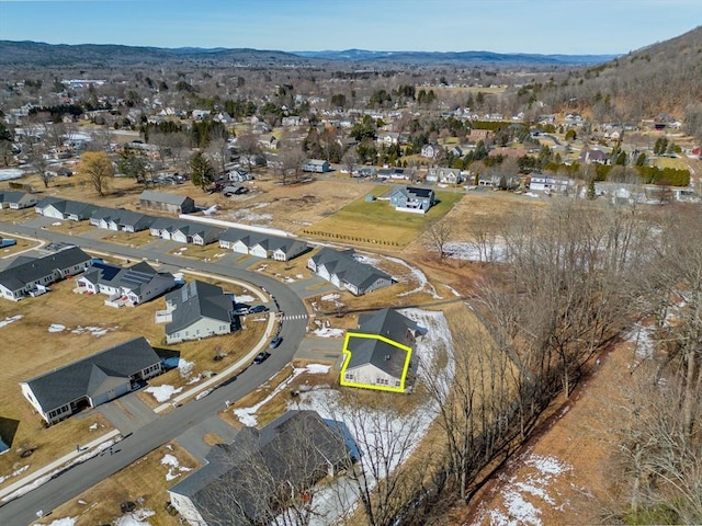 birds eye view of property featuring a mountain view and a residential view