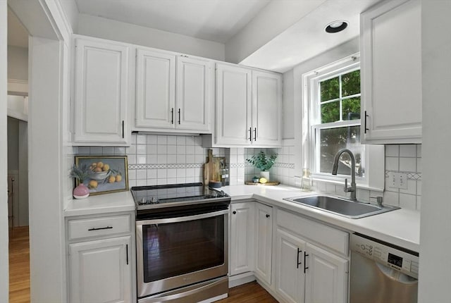 31 Dudley St, North Andover, MA 01845 - kitchen featuring appliances with stainless steel finishes, white cabinets, and light countertops