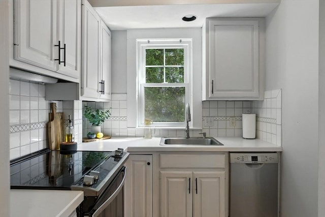 31 Dudley St, North Andover, MA 01845 - kitchen featuring dishwasher, electric range, backsplash, and white cabinetry