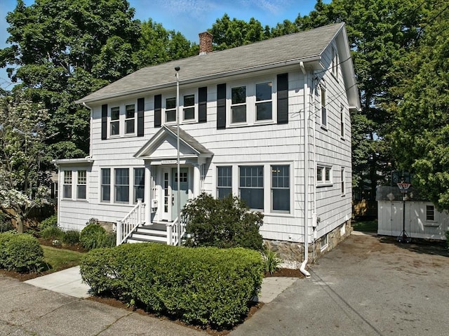31 Dudley St, North Andover, MA 01845 - colonial house with a chimney and an outdoor structure