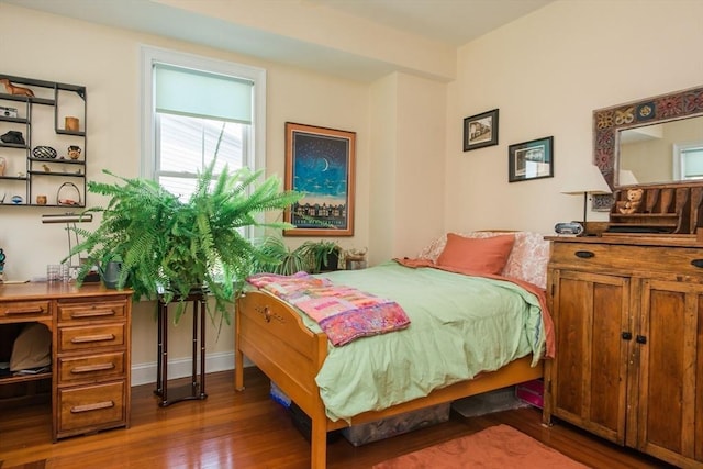 bedroom with wood finished floors