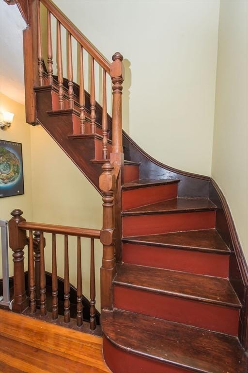 stairway with wood finished floors