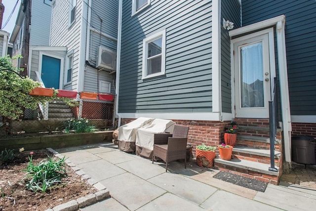 view of patio / terrace with ac unit and fence