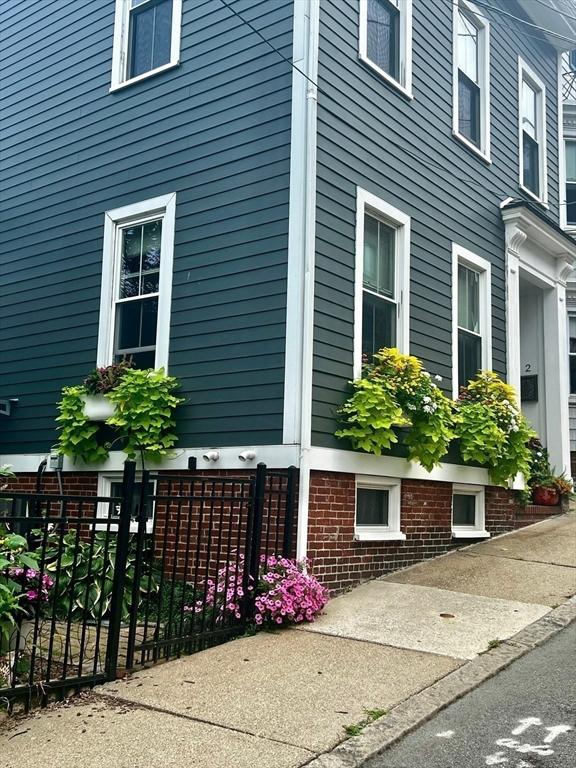 view of property exterior with fence