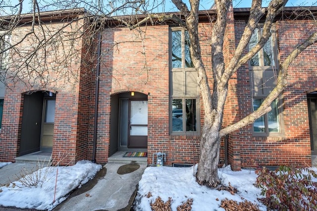 view of property featuring brick siding