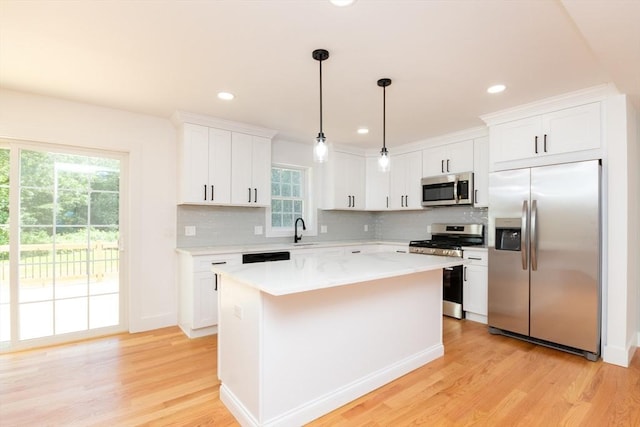 776 Allen St, Dartmouth, MA 02747 - kitchen featuring appliances with stainless steel finishes, light wood-style floors, backsplash, plenty of natural light, and recessed lighting