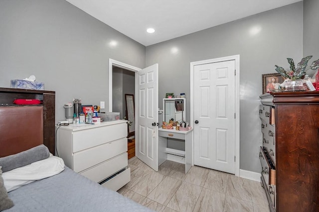 bedroom featuring baseboards