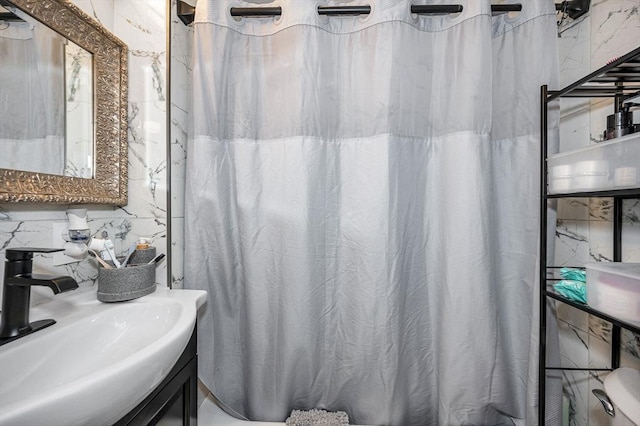bathroom with a sink and a shower with curtain