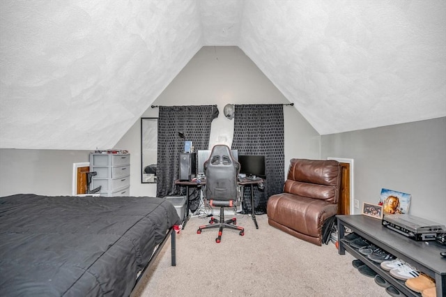 bedroom featuring carpet, a textured ceiling, and lofted ceiling