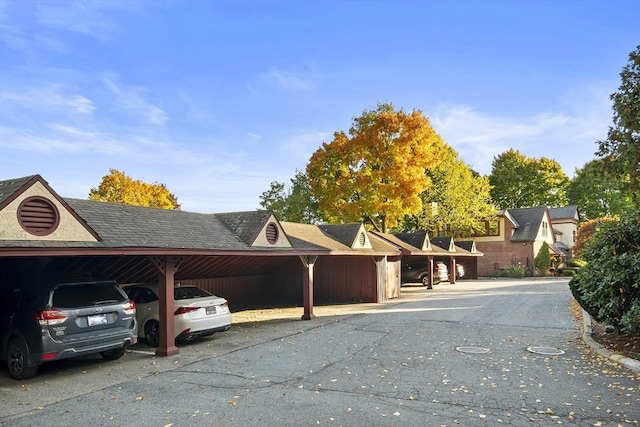 view of parking / parking lot with a carport