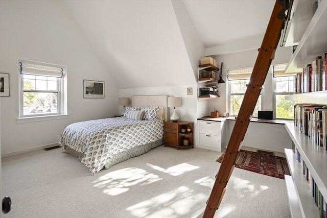 carpeted bedroom with vaulted ceiling