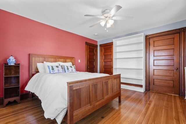 bedroom featuring hardwood / wood-style flooring and ceiling fan