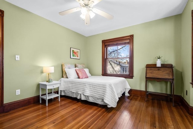 bedroom with hardwood / wood-style floors and ceiling fan