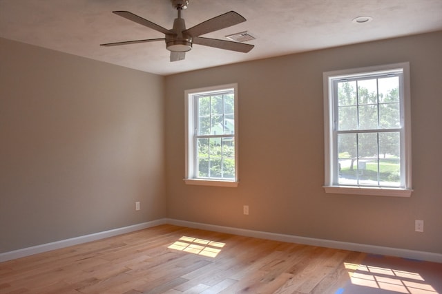 spare room featuring light hardwood / wood-style flooring and ceiling fan