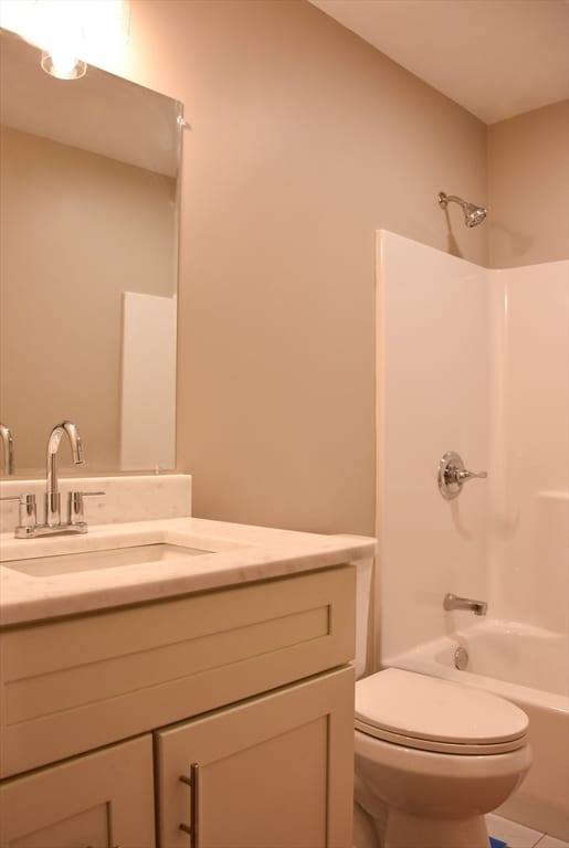 full bathroom featuring vanity, toilet, and bathing tub / shower combination