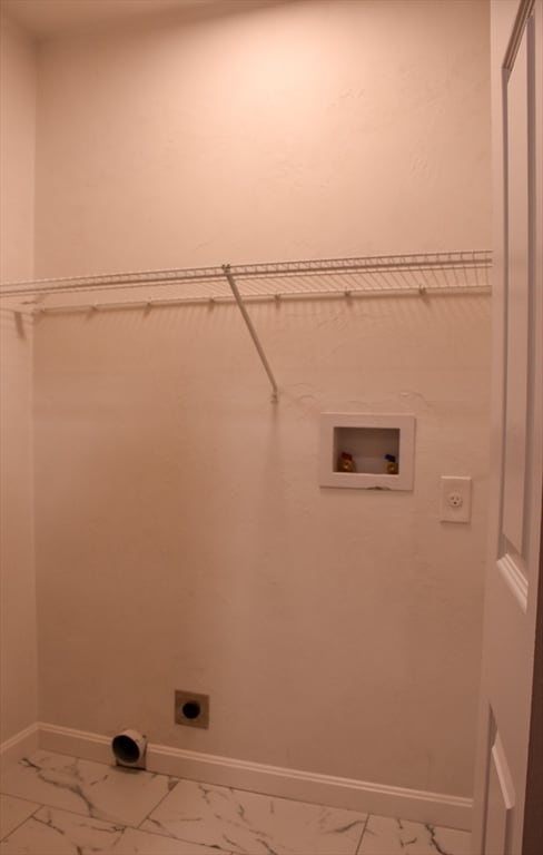 laundry room featuring hookup for a washing machine, tile patterned floors, and hookup for an electric dryer