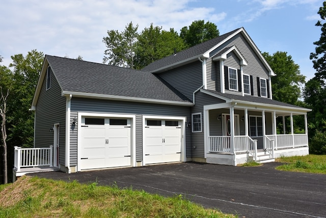 view of front facade with a garage and covered porch