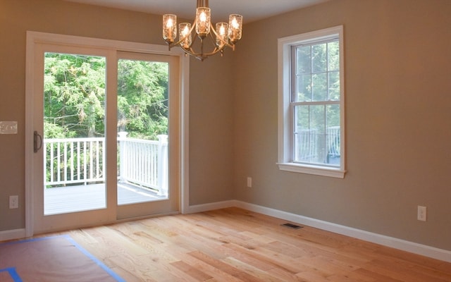 interior space with light hardwood / wood-style flooring and a healthy amount of sunlight