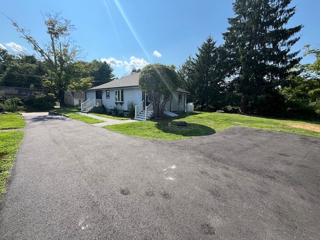 exterior space with a front lawn