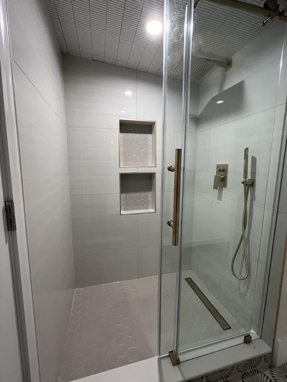 bathroom with a shower stall