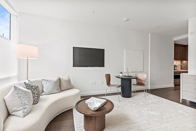 living room with dark hardwood / wood-style floors