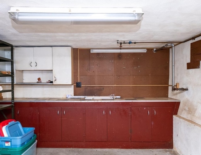 interior space with open shelves and light countertops