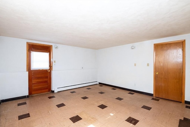 unfurnished room featuring light floors, a baseboard radiator, and baseboards