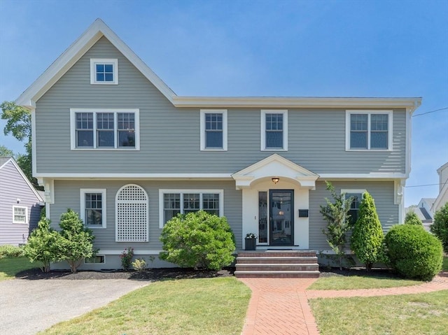 61 Colonial Dr, Arlington, MA 02474 - colonial-style house with a front lawn