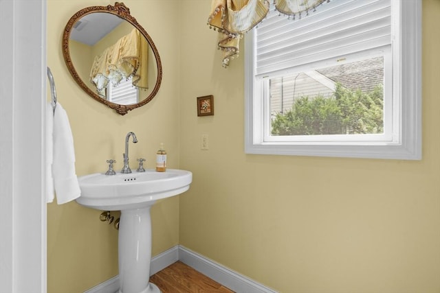 61 Colonial Dr, Arlington, MA 02474 - bathroom featuring baseboards and a sink