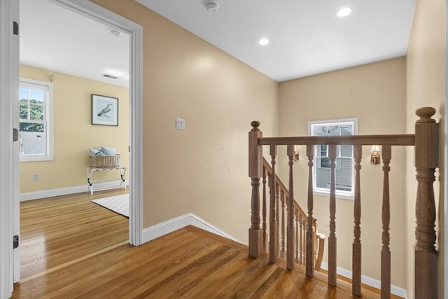 61 Colonial Dr, Arlington, MA 02474 - hallway with wood finished floors, an upstairs landing, and recessed lighting