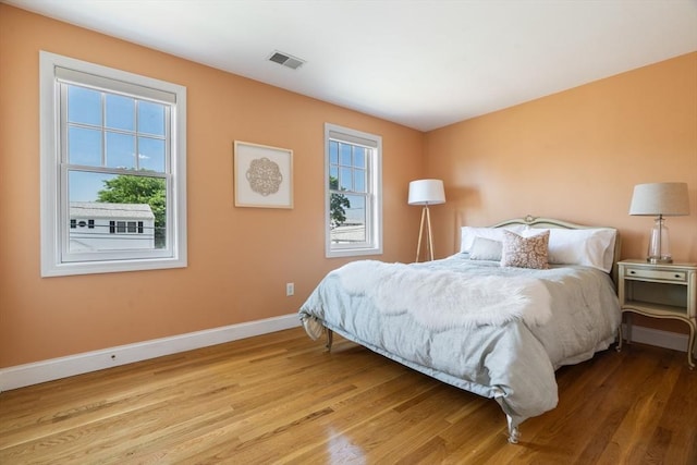 61 Colonial Dr, Arlington, MA 02474 - bedroom with baseboards and wood finished floors