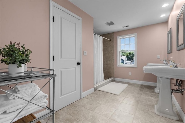 61 Colonial Dr, Arlington, MA 02474 - bathroom featuring a shower with shower curtain and recessed lighting