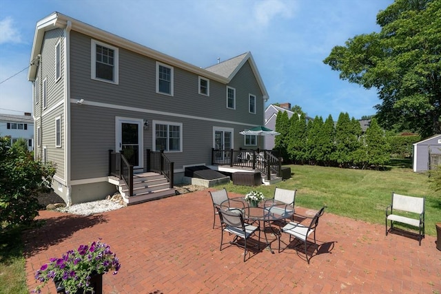 61 Colonial Dr, Arlington, MA 02474 - rear view of property featuring a patio area, a yard, a deck, a storage unit, and outdoor dining area