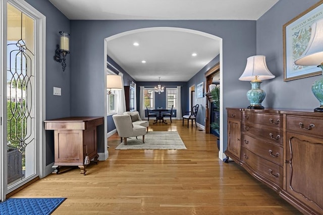 61 Colonial Dr, Arlington, MA 02474 - foyer with arched walkways, light wood-type flooring, a chandelier, and recessed lighting