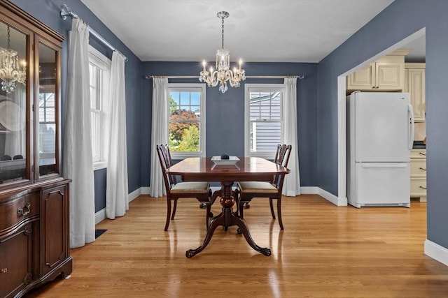 61 Colonial Dr, Arlington, MA 02474 - dining area featuring a chandelier and light wood finished floors