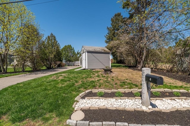 view of yard with an outbuilding and a storage shed